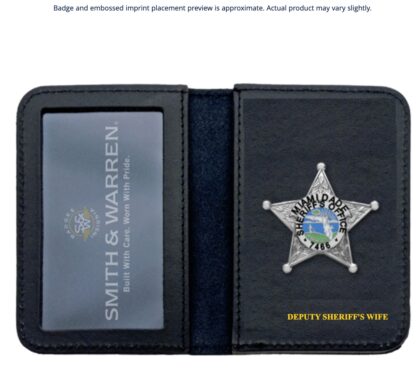 Open black leather wallet with a silver deputy sheriff badge on the right panel and yellow caption 'DEPUTY SHERIFF’S WIFE' at the bottom.